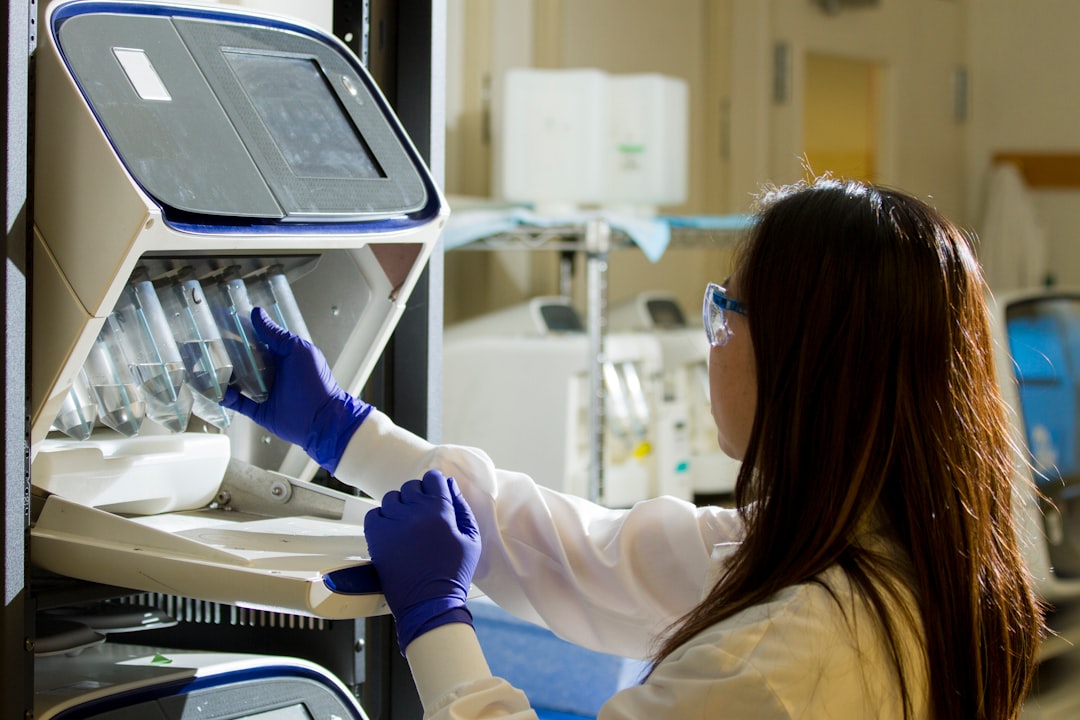 Researcher preparing biotech drug samples for subcutaneous formulation testing